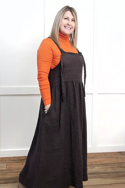 Chille Merino Whisper Top in orange under chocolate sofia pinafore dress side view
