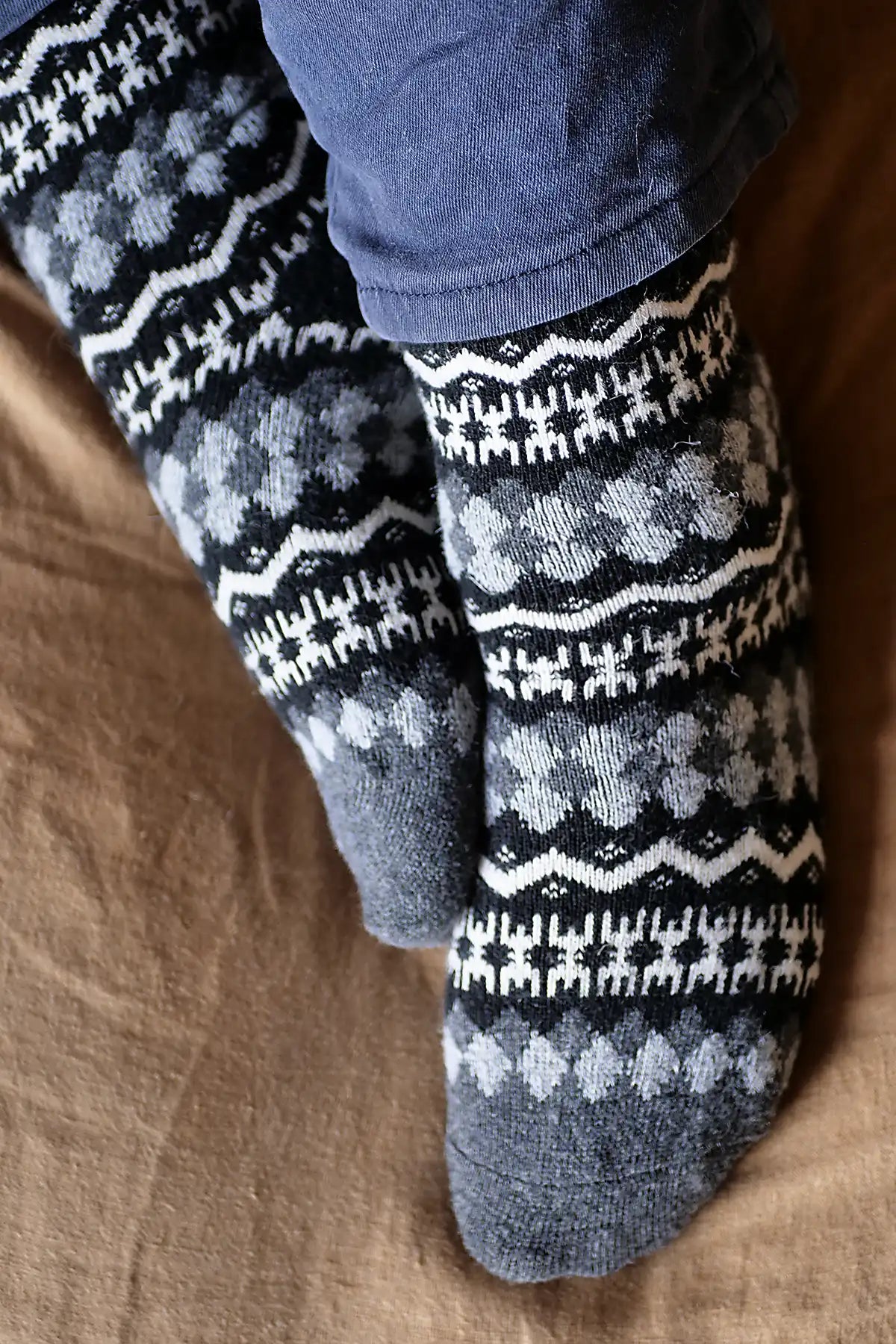 Pair of patterned socks on a wooden floor