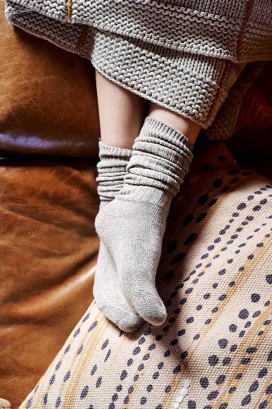 Chille Wool Blend Socks in Grey with feet on the sofa