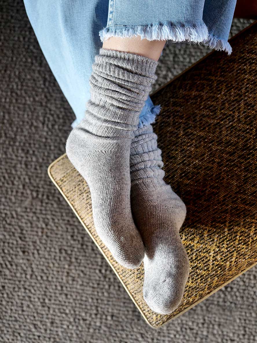 Chille Wool Blend Socks in Grey with feet on the footstool