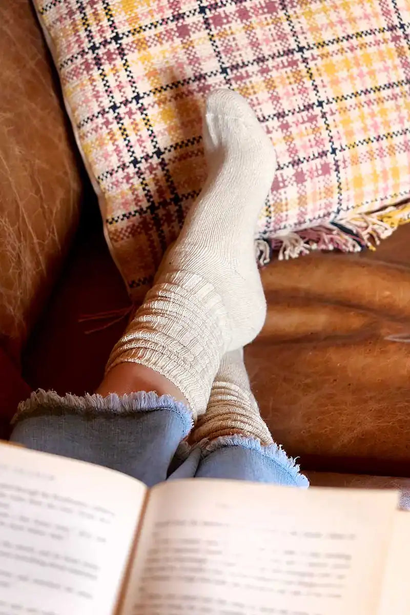 snuggled on the coach with a nice book in a pair of Chille Wool Blend Socks - Bone