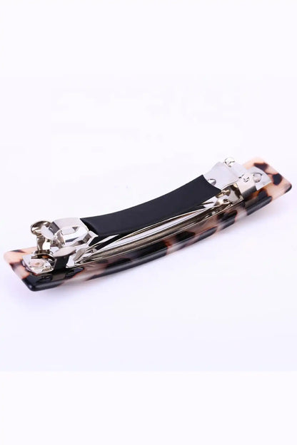 Classic Acetate Barrette Clip Light Tortoiseshell on a white background underside view of mechanism