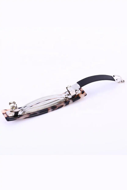 Classic Acetate Barrette Clip Light Tortoiseshell on a white background underside view showing clasp open
