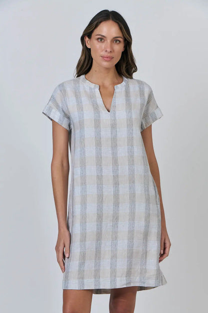 Woman wearing a Coastal Drift Linen Dress in Mesh against a plain background front detailed view
