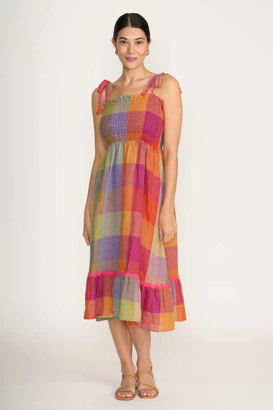 Woman wearing a Foil Linen Moral fibre Dress in Fiesta Check on a white background