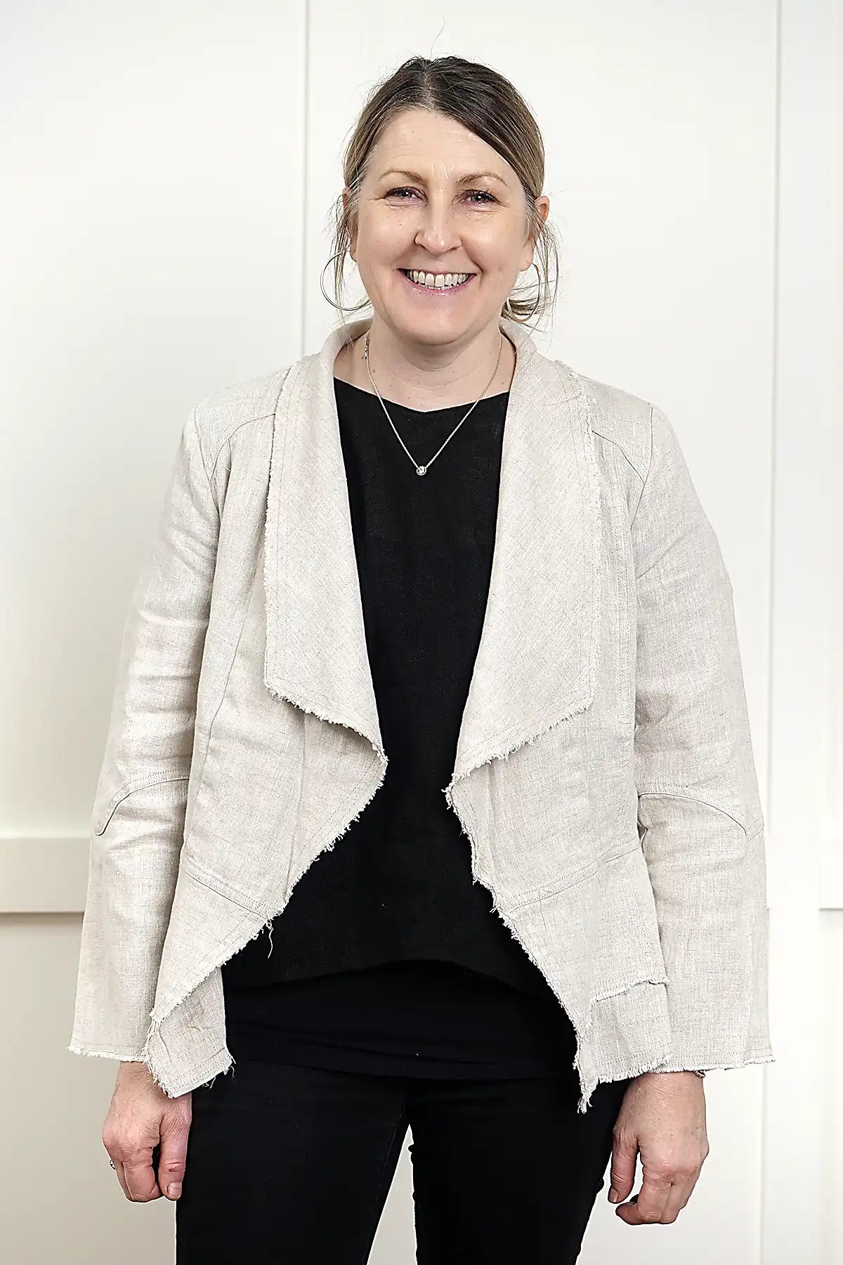 Francesca Linen Jacket in Natural standing against a white wall