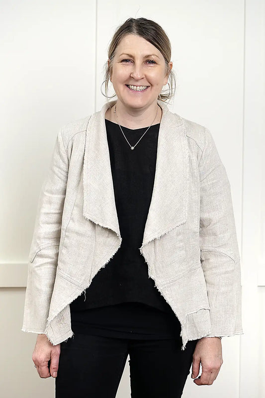 Francesca Linen Jacket in Natural standing against a white wall