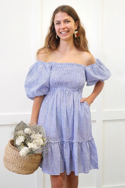 Kallie Puff Sleeves Dress in Blue Stripe front wearing off the shoulder with basket of flowers