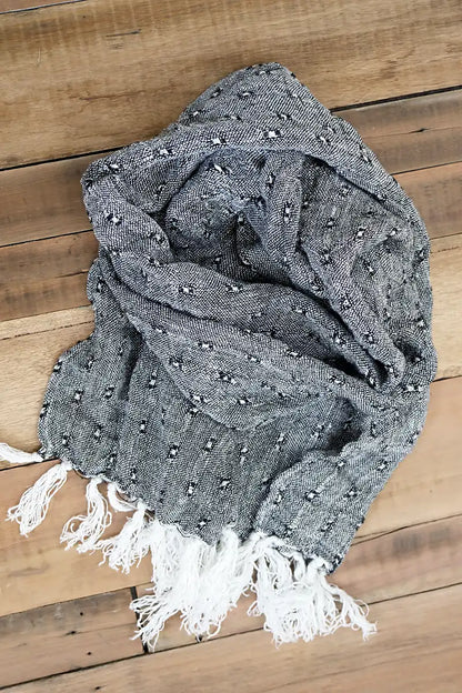 Le Quai Linen Scarf – Hand-Loomed in Monochrome flat lay on the floor