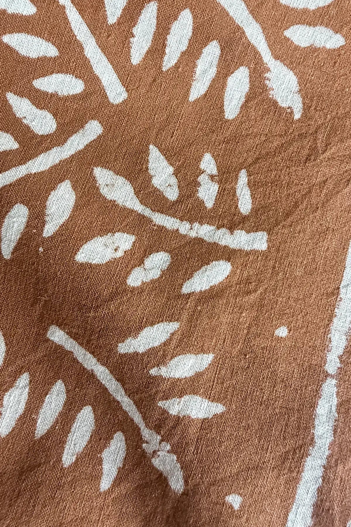 cinnamon fabric with white leaf detail