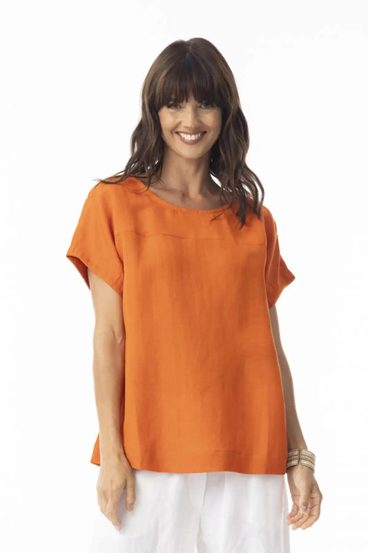 Woman wearing an Orientique Escape Linen Solid Boxy Top in Mandarin on a white background