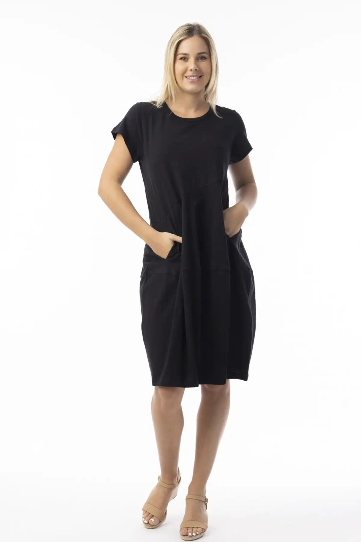 Woman wearing a Orientique Essentials Organic Cotton Bubble Dress in black on a white background