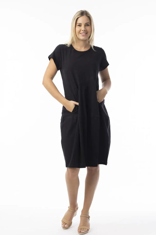 Woman wearing a Orientique Essentials Organic Cotton Bubble Dress in black on a white background