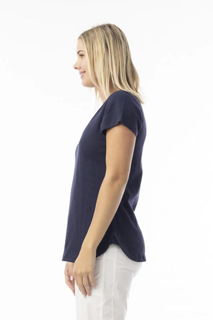 Woman wearing a Orientique Essentials Organic Cotton Crew Tee in Navy and white pants on a white background