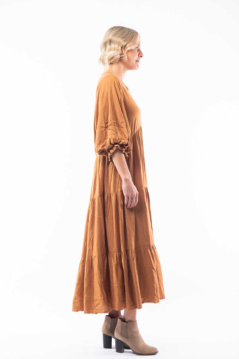 side view of the Orientique Solid Moss Maxi Dress in Umber