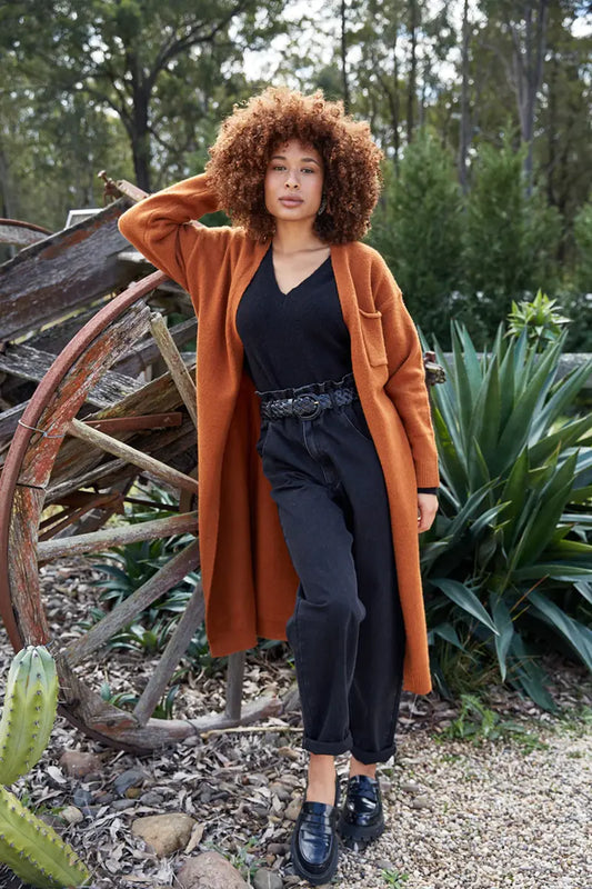 Paarl Longline Cardigan in Ochre by Eb & Ive with model in the garden