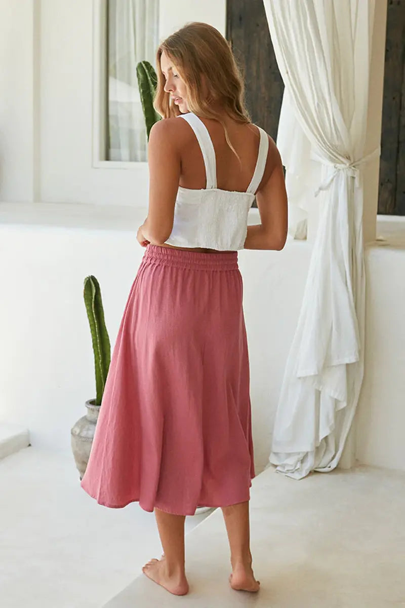 back view of the Buddha Wear Pippa Midi Skirt in Pink