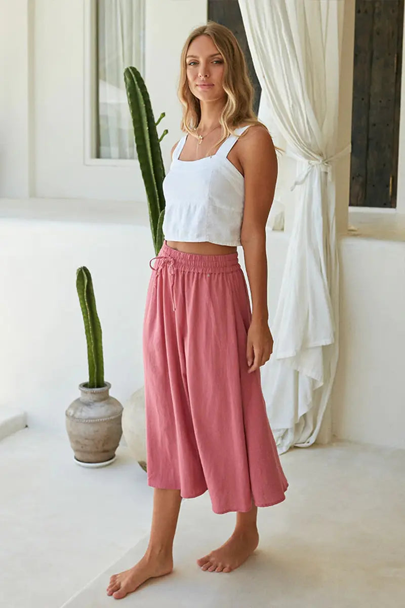 side view of the Buddha Wear Pippa Midi Skirt in Pink