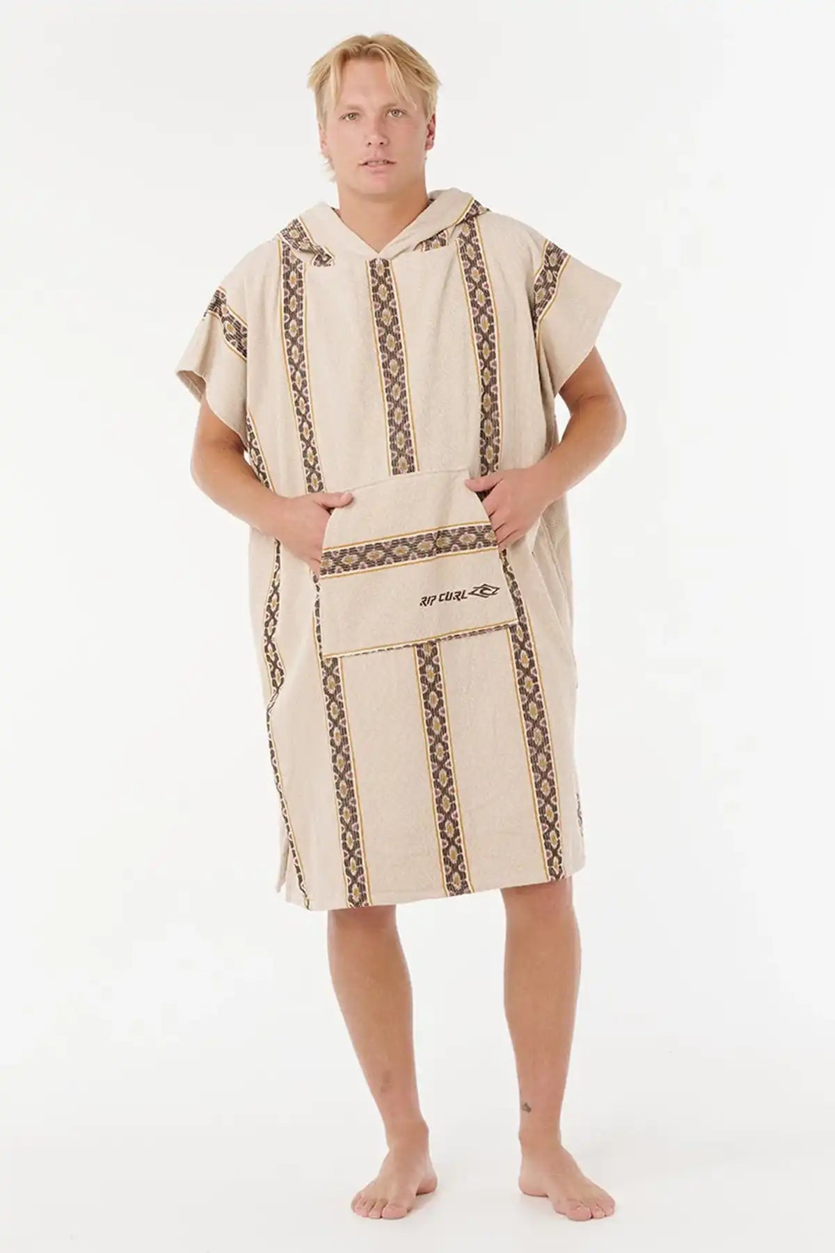 Man wearing a beige towel with brown patterns on a white background