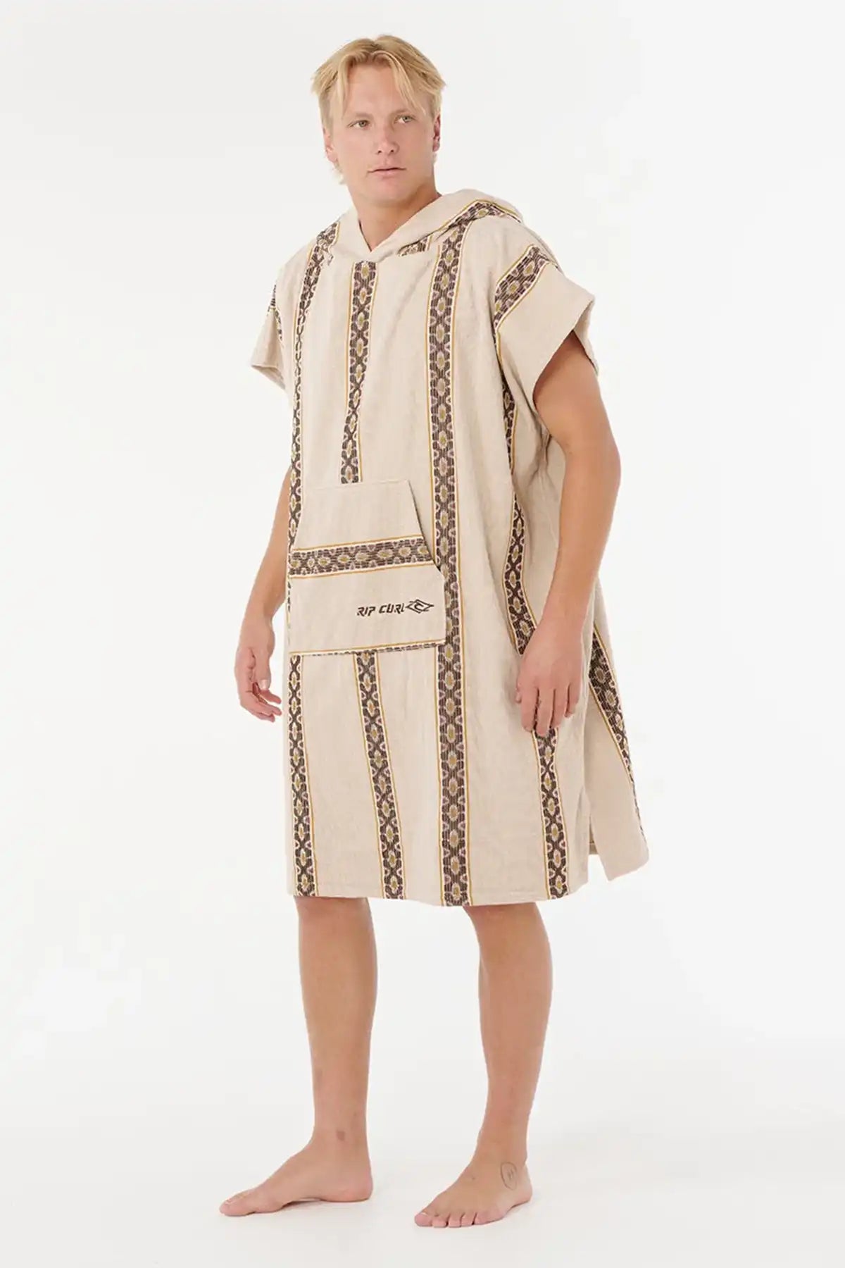 Man wearing a beige hooded towel with brown embroidery on a white background