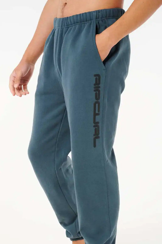 Rip Curl Dosed Up Track Pant in Pine Night front 3/4 view with hand in pocket