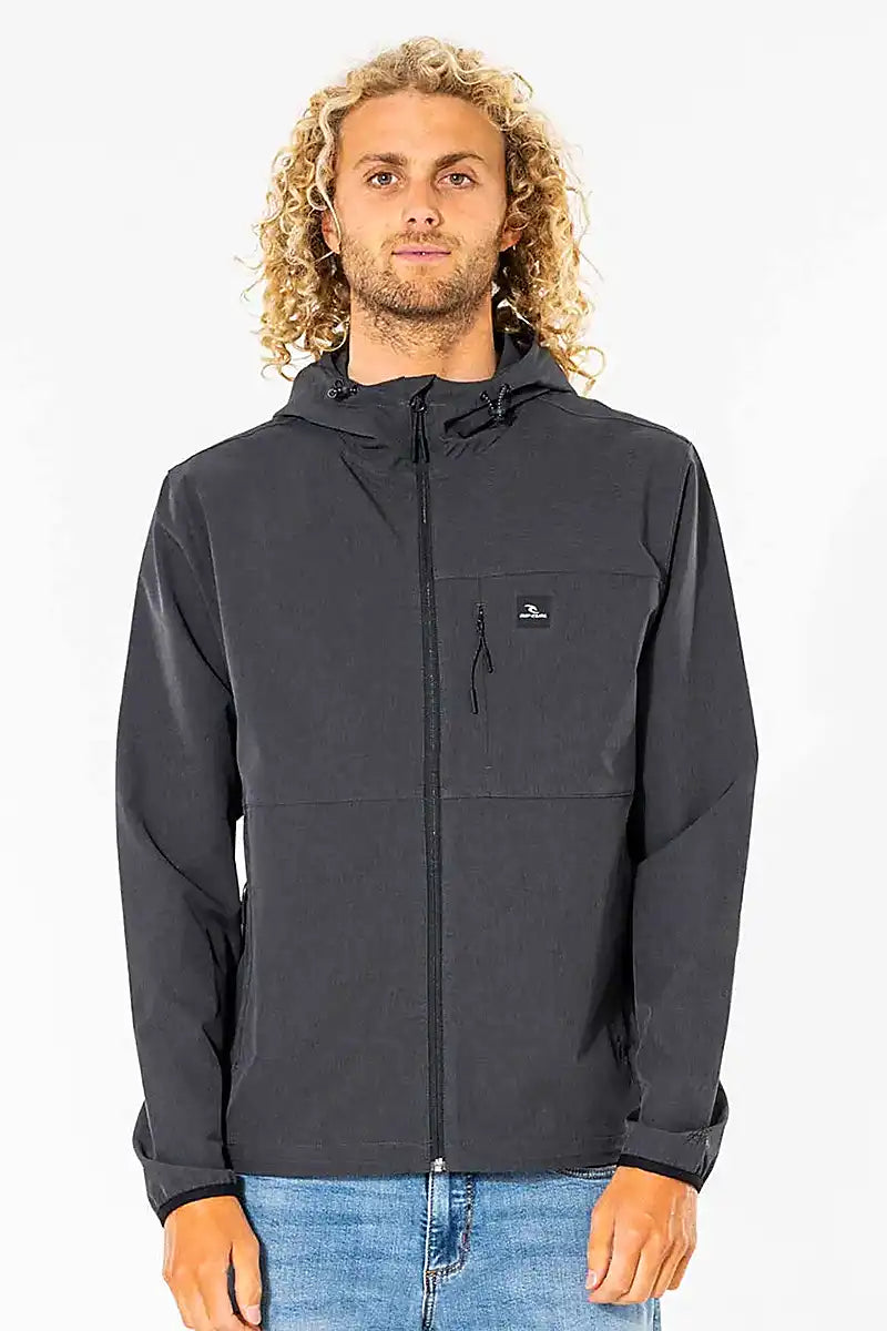 Man wearing Rip Curl Elite Anti-Series Zip Through Jacket with a hood on a white background front view