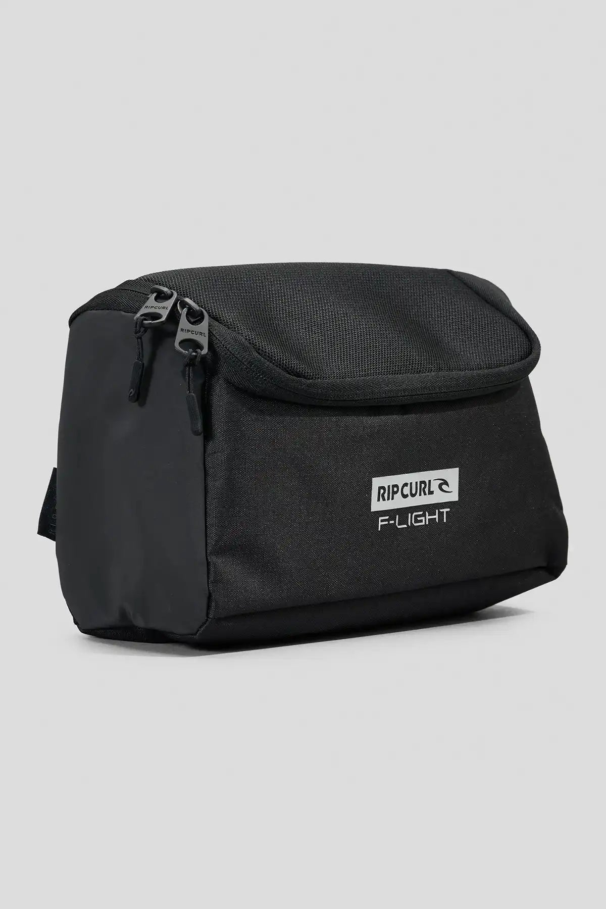 Black Rip Curl F-Light Icons toiletry bag with Rip Curl logo on a light gray background