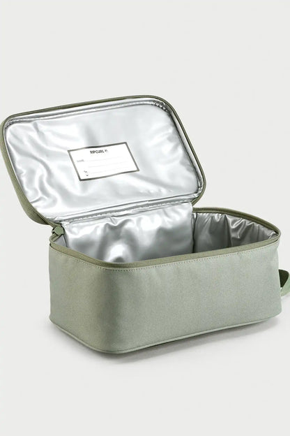 Rip Curl Sea Spray Green insulated lunch bag with a white label on a light gray background