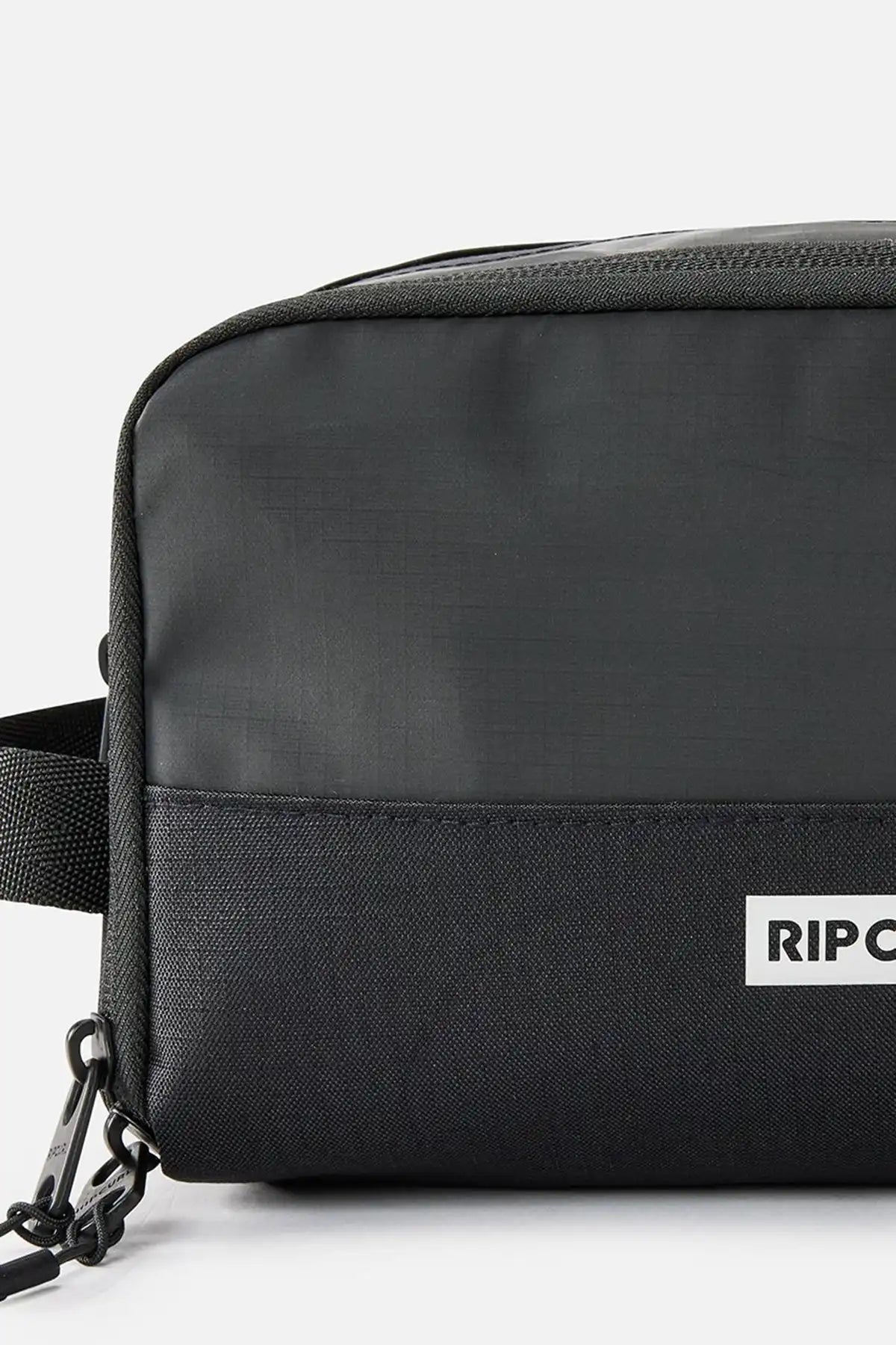 Black crossbody bag with 'Rip Curl' logo on a white background