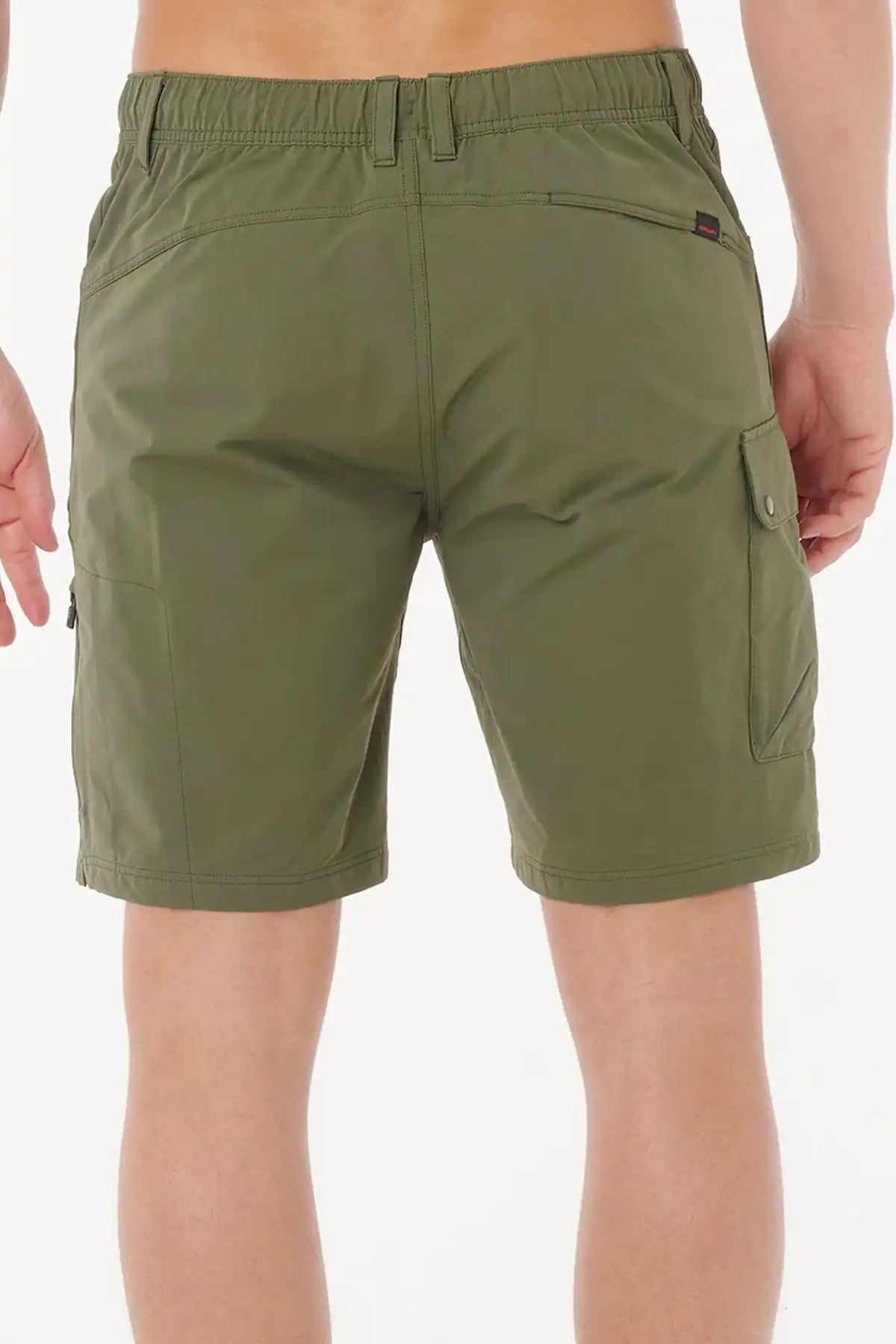 Rip Curl deep cactus green shorts worn by a person on a white background