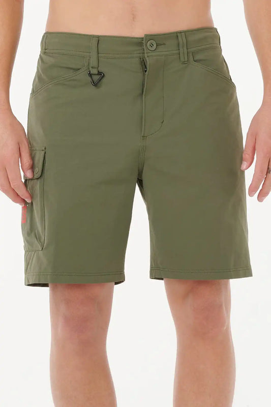 Deep Cactus Green Rip Curl shorts worn by a person on a white background
