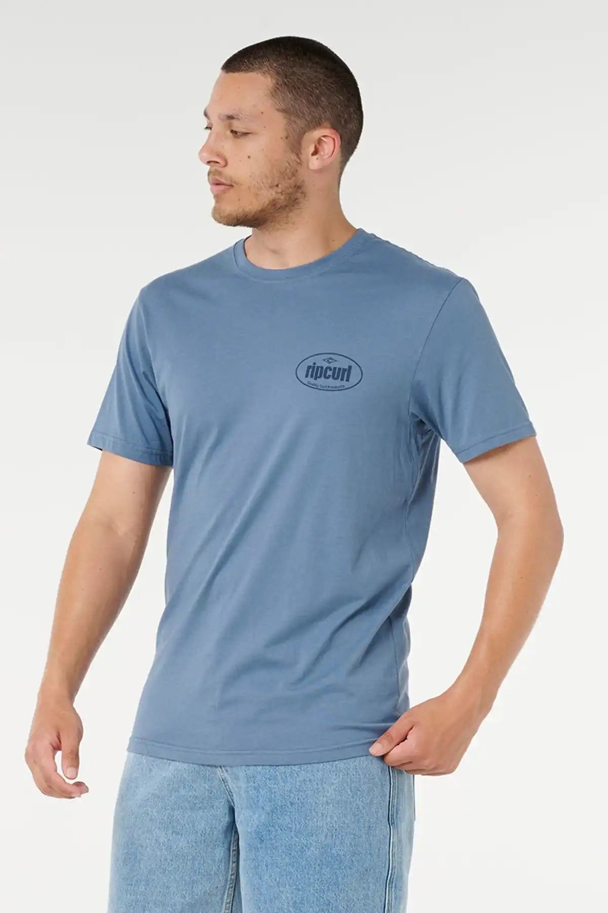 Man wearing a blue t-shirt with a Rip Curl Logo on a white background
