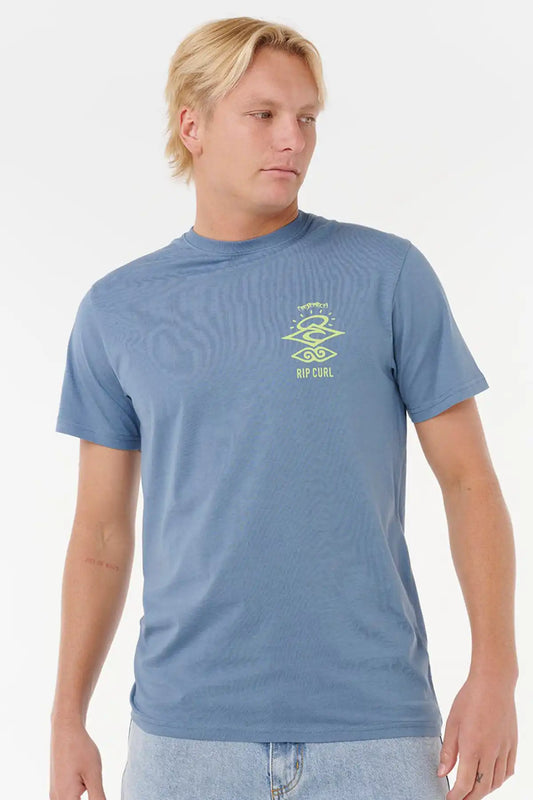 Man wearing a Rip Curl Mens Search Icon Tee in Blue Fin with a logo on a white background