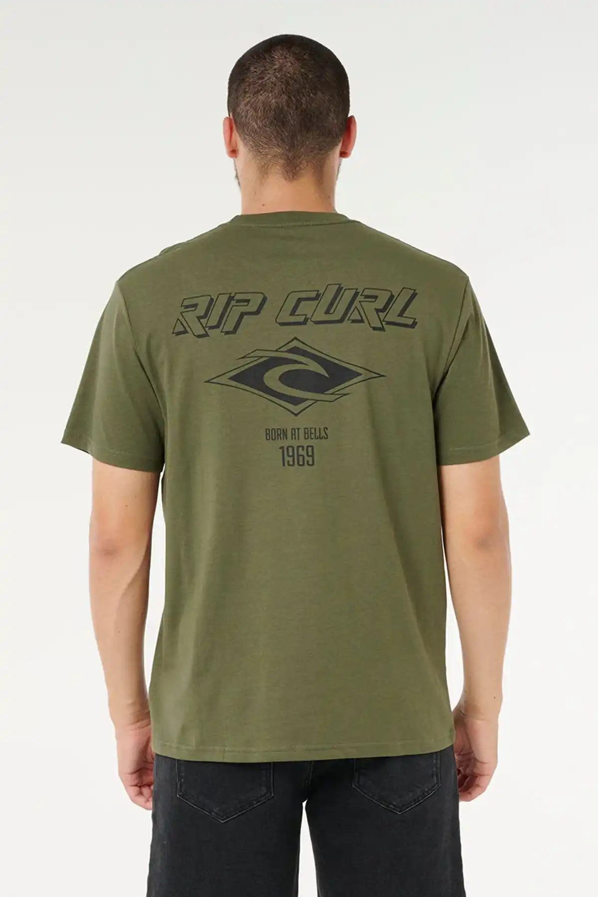 Person wearing a green Rip Curl t-shirt with branding on the back against a white background