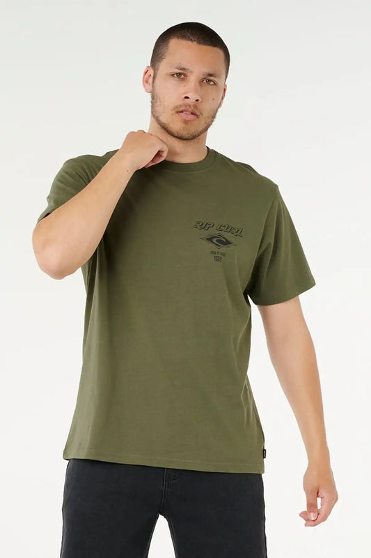 Man wearing a Rip Curl green t-shirt with a logo on a white background
