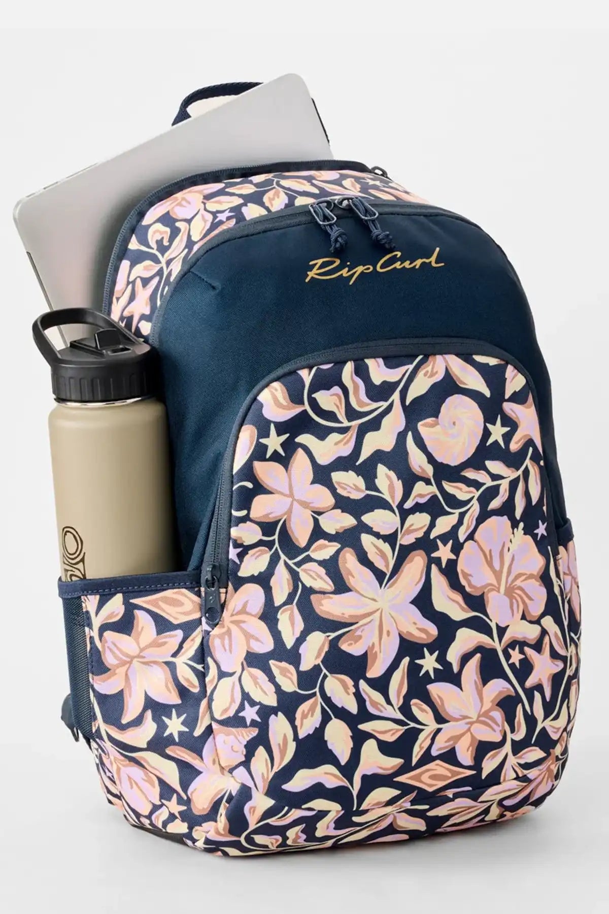 Floral-patterned backpack with a laptop and water bottle on a light gray background