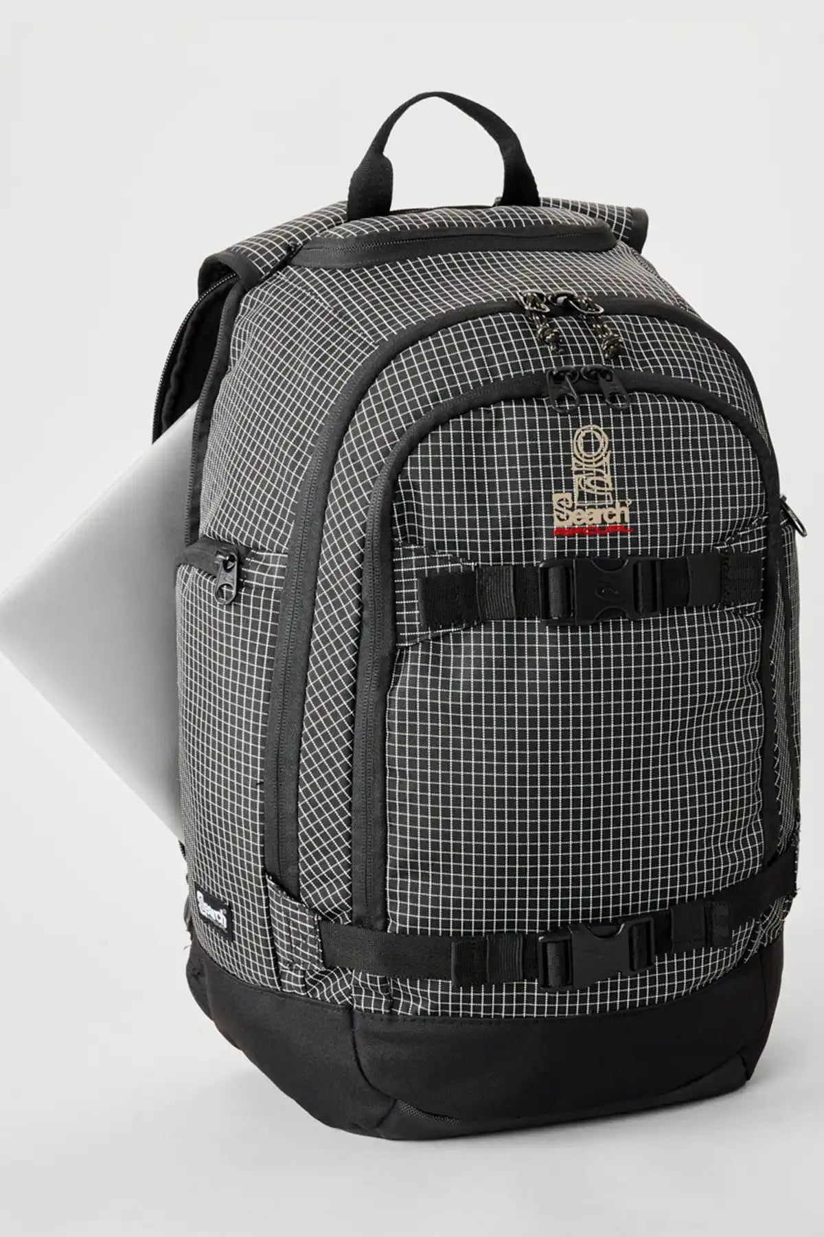 Rip Curl Posse Ripstop 33L black/white  checkered backpack with black straps on a light gray background