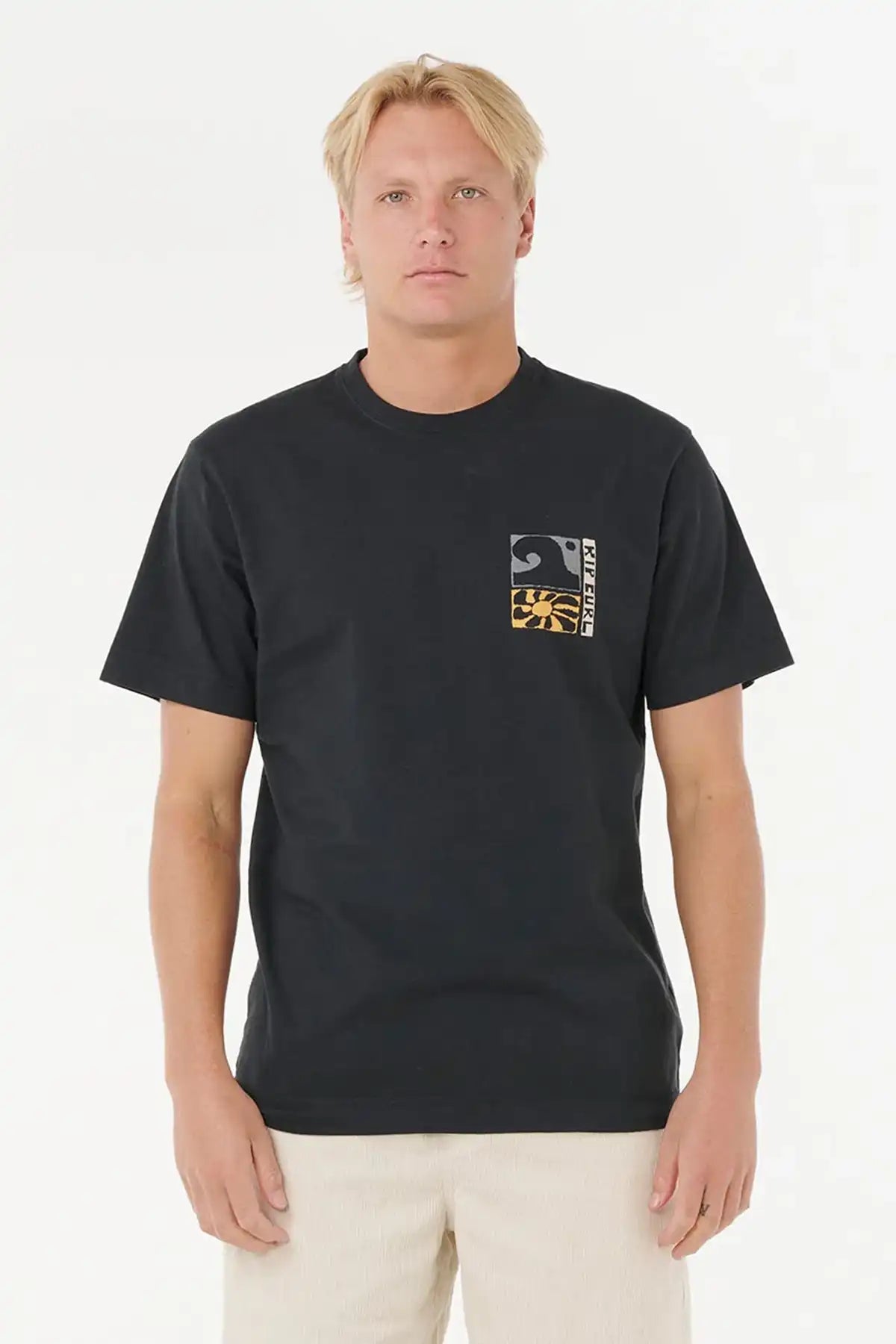 Man wearing a black t-shirt with a small Rip Curl graphic on a white background