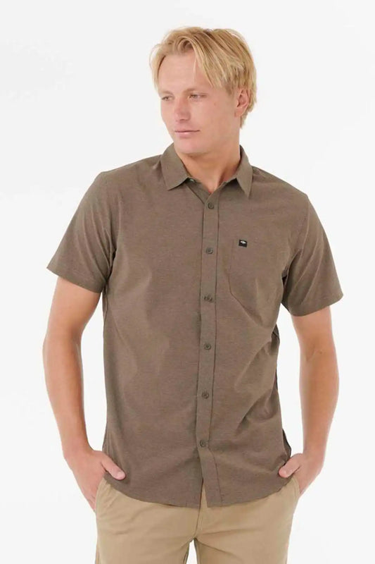 Man wearing a brown short-sleeve shirt on a white background