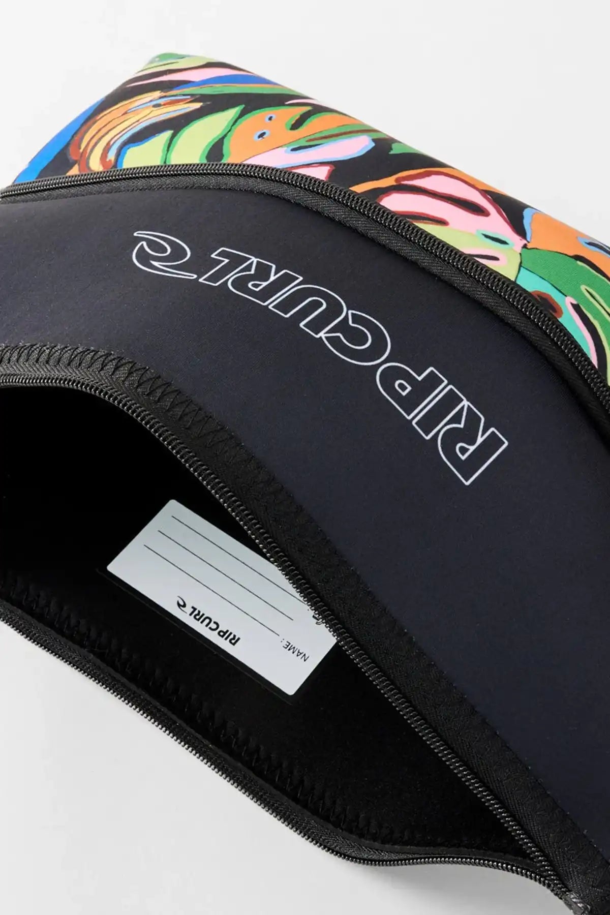 Rip Curl pencil case showing inside name label section with zipper section open