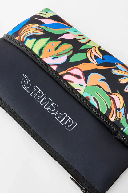 side view of Rip Curl branded pencil case with bright leaf pattern front
