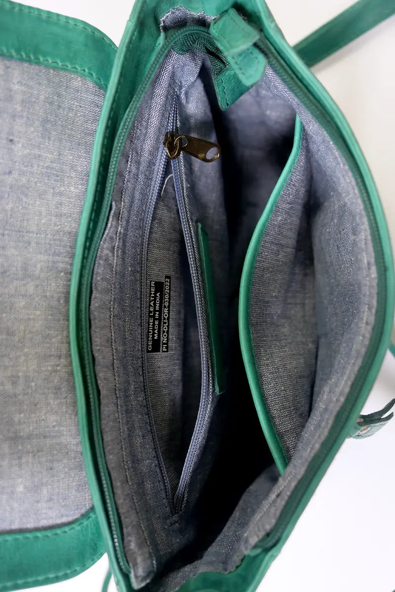 Rugged Hide Jessica Cross Body Bag in Pine Green inside of the internal zip pocket
