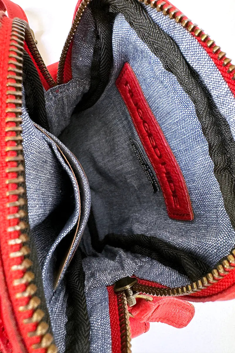 view of the main compartment in the Rugged Hide Leather Bag - Small Sling Hailey Red