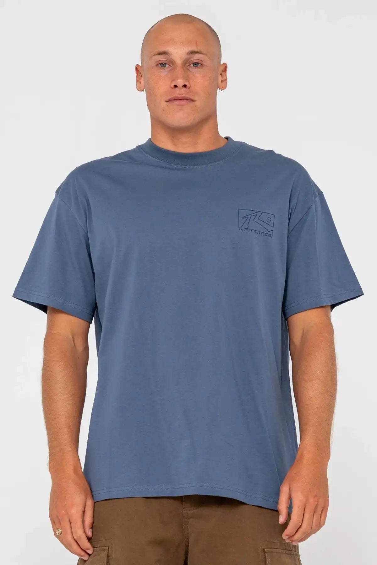 Rusty Boxed Out Graphic Tee in China Blue with small rusty logo on chest and pinecone shorts on a white background