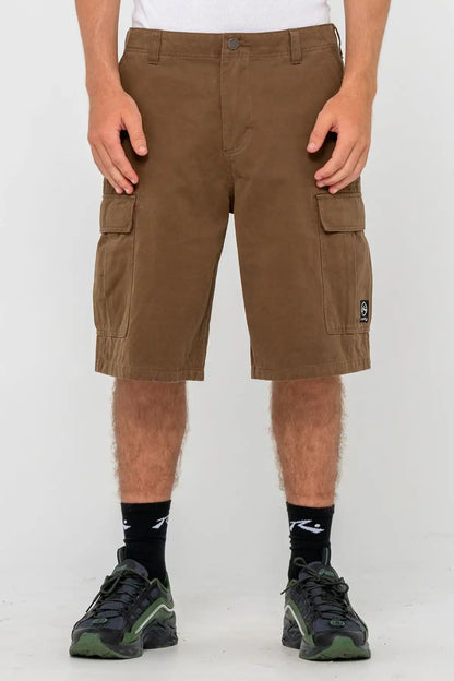 Rusty Commando 23" Baggy Cargo Short in Pinecone worn by a person on a white background