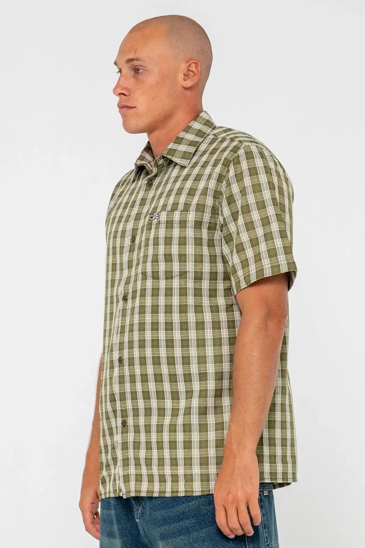 Man wearing a green and white checkered shirt against a plain background