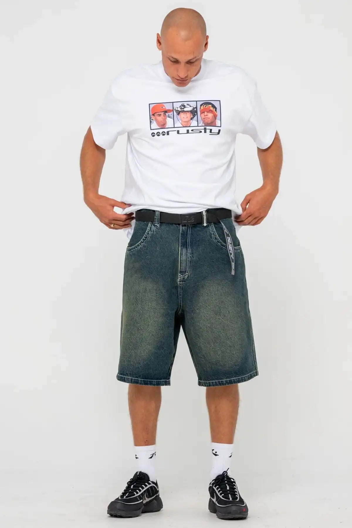 man wearing a Rusty Jagged Webbing Belt in black on the white background