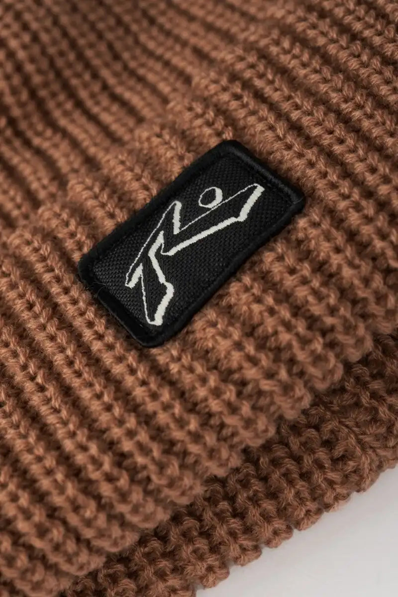 Rusty United Thinsulate Beanie in Beaver Brown logo patch detail view