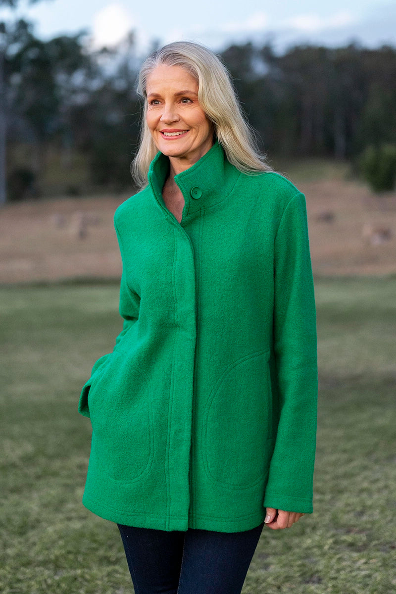 See Saw Boiled Wool Funnel Neck Coat in Emerald front with one hand in pocket