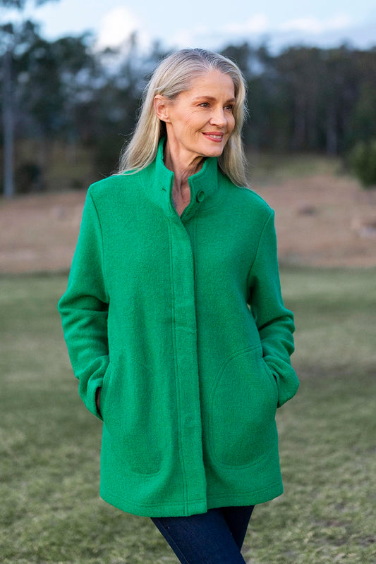 See Saw Boiled Wool Funnel Neck Coat in Emerald front hands in pockets